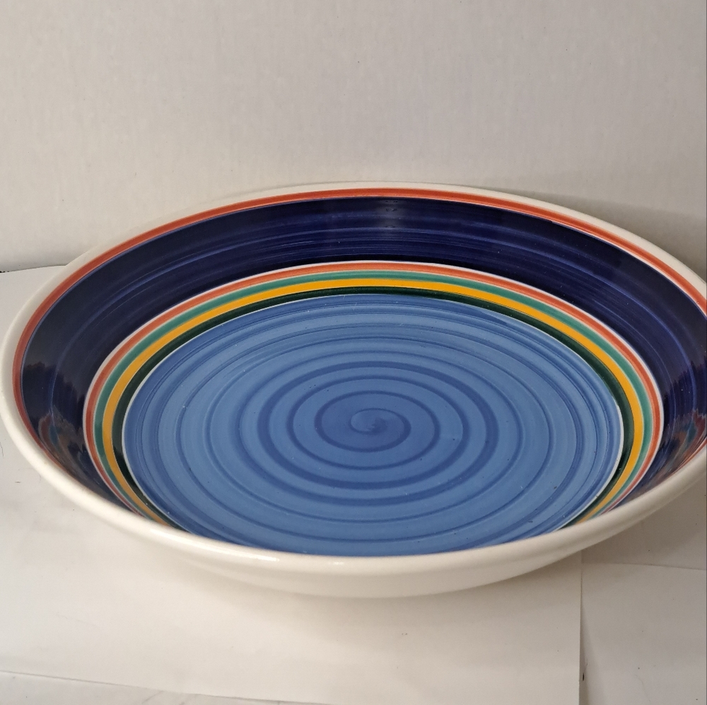 Large Bowl, Made Italy, two Blue tone colours and Red and Mustard Swirl colours.